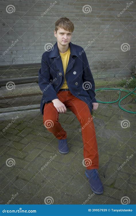 Handsome Young Man Sitting On A Bench Stock Image Image Of Green