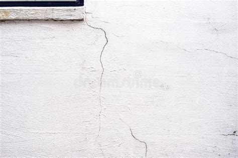 Cracks On The Plastered White Wall Of An Old House Reconstruction Work