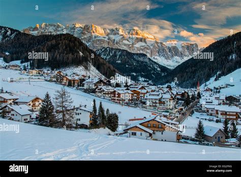 Winter View At Sunset Of Selva Di Val Gardena With Sella Massif In The
