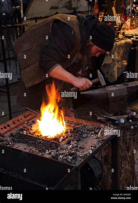 Blacksmith At Work At His Forge Image In Portrait Format Stock Photo