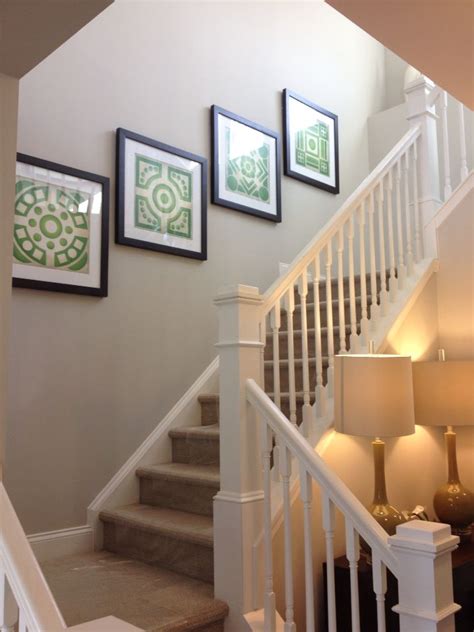First, we will look at the various kinds of straight stairs use up a fair amount of linear space, particularly if you are required to add a landing midway up. Oversized wall decor going up stairs. Very nice so the wall isn't blank! Seen in a model home ...