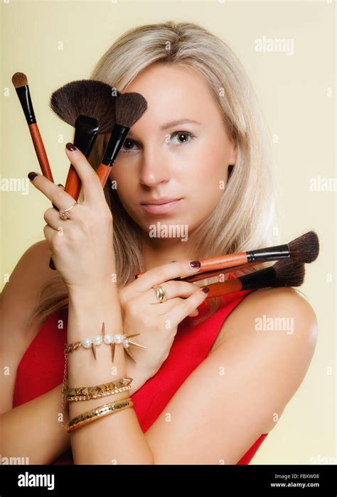 Beauty Procedures Woman Holds Make Up Brushes Near Face Stock Photo