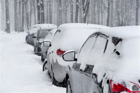 Premium Photo Cars Standing In The Snowy Parking Lot In Winter Day