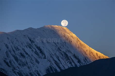 Sunset Of The Full Moon During The Morning Dawn On The Background Of