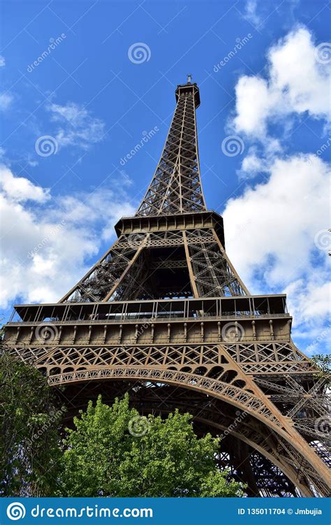Eiffel Tower Perspective From Below Paris France Trees And Blue Sky