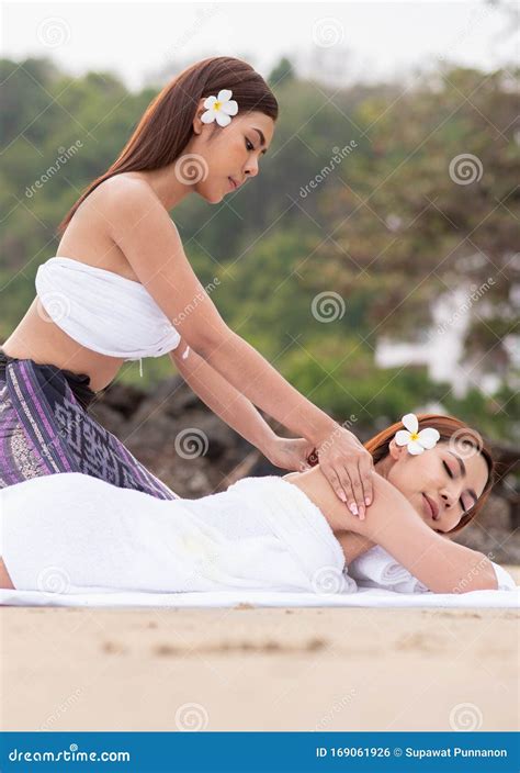 Beautiful Asian Woman Enjoying Spa Massage Therapy On The Beach Stock Photo Image Of Care