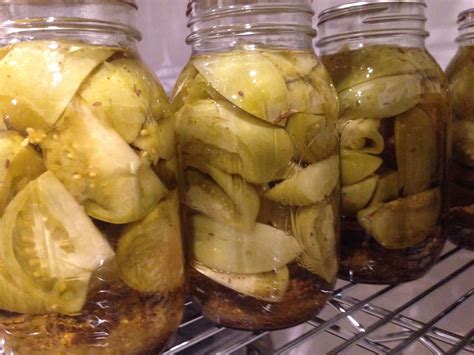 Pour the warm pickling liquid over the tomatoes in each jar, stopping 1/2 inch from the top. pickled green tomatoes | Mrs Wheelbarrow's Kitchen