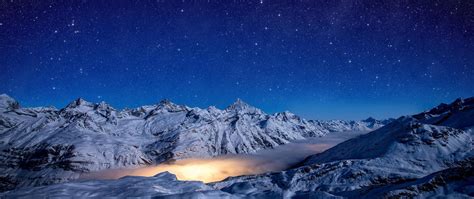 2560x1080 Starry Night Snow Covered Mountains 4k 2560x1080 Resolution