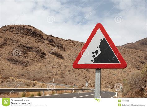 Road Sign Warning Of Falling Rocks In Spain Stock Photo