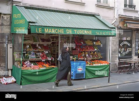 A Typical French Grocery Store In Paris Offering A Sidewalk Display Of
