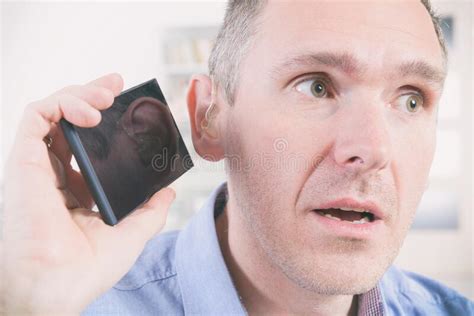 Man Wearing Deaf Aid With Tablet Stock Image Image Of Adult Deafness