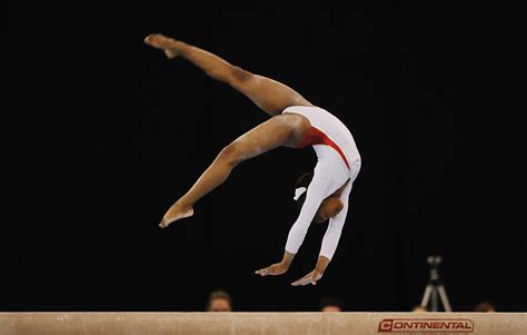 Here's a place for you to post all of your gymnastics pictures and ask me, a gymnast, any questions about the sport. Gymnast on the Beam during the Gymnastics at the Excel Cen ...