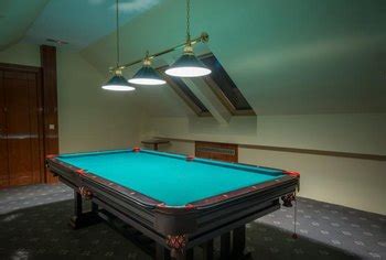 The most common pool table light material is metal. Distance Between Pool Tables and Lights | Home Guides | SF Gate