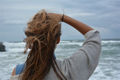 Woman Facing The Ocean During Day · Free Stock Photo