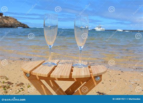 two glasses of champagne on the beach with sea bac stock image image of holiday champagne