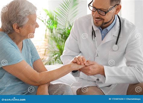 Doctor Visiting Senior Patient In Hospital Stock Photo Image Of