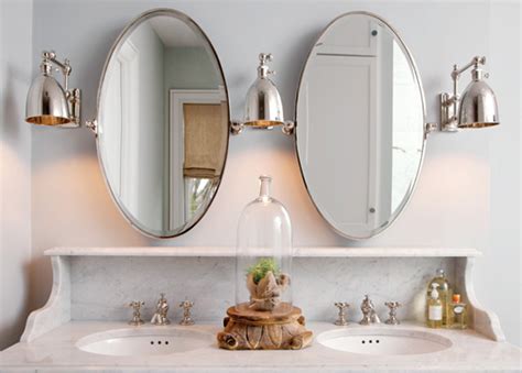 Mirrors can be installed with wall anchors, french cleats, mirror clips, or mirror mastic. Oval Pivot Mirrors - Transitional - bathroom - Capital Style