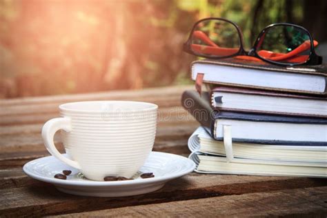 Eyeglasses On Book With Hot Coffee Cup On Nature Background Vintage Filter Learning Concept