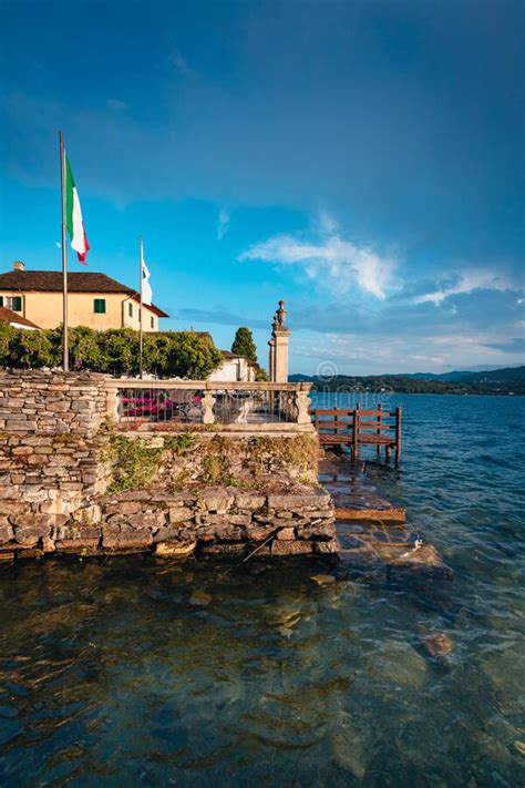 View Of A Building On Lake Orta With The Island Of San Giulio In The