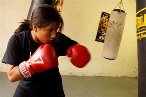 Girl In Red Boxing Gloves Punching Heavy Bag Side 1 Of 1 The