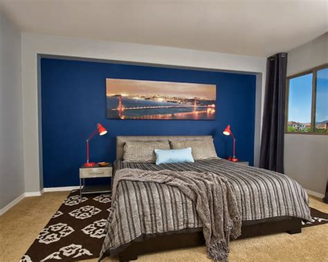 That black headboard puts a coma to introduce the sketch ink and pearl bedding ensemble. Blue Accent Wall | Houzz