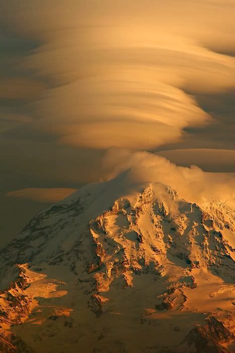 Lenticular Clouds Over The Mountain At Sunset Lenticular Clouds