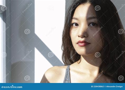 Portrait Beautiful Asian Girl Half Sunlit Dark Hair And Eyes Red