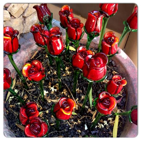 Maybe you would like to learn more about one of these? Found these red glass roses outside Chapel of the Flowers ...