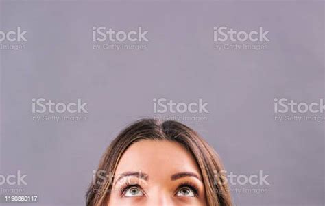 Half Face Of Adorable Womans Face Looking Up Above Copy Space Stock