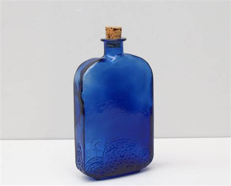 Vintage Cobalt Blue Glass Bottle Embossed With A Floral Design Old Blue Asymmetrical Glass