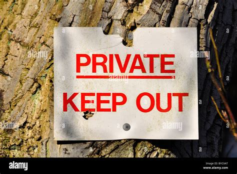 Private Keep Out Sign Nailed To A Tree Stock Photo Alamy