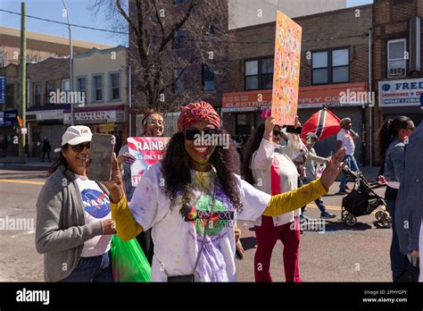 People Covered In Colored Powder At The Phagwah Holi Parade 2023 In