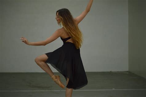 Beautiful ballerina dancing in studio · Free Stock Photo