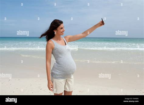 Portrait Of Pregnant Woman Portrait Of Pregnant Woman At Beach Hi Res