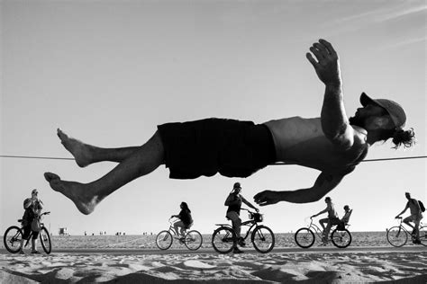 Dramatic Perspectives Capture Uniquely Juxtaposed Beachgoers In Street