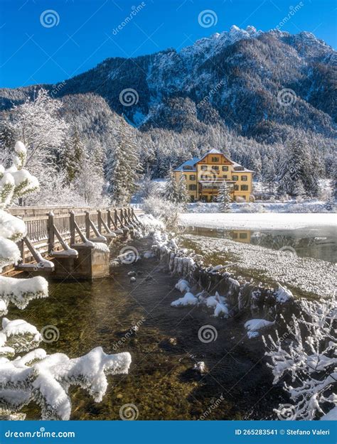 A Sunny Winter Morning At A Snowy And Iced Lake Dobbiaco Province Of