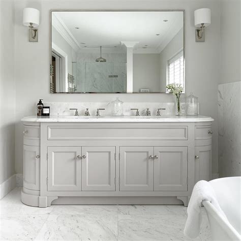 This master bathroom double sink vanity is lit by a strip of warm white leds, as well as two modern bathroom pendants. Pin on DIY Furniture Ideas