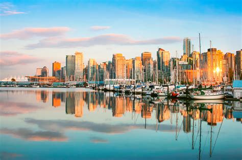 Beautiful View Of Vancouver Skyline With Stanley Park At Sunset