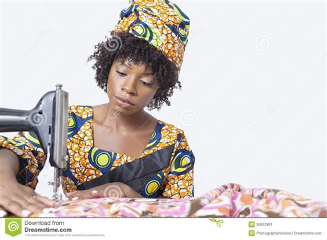 African American Female Fashion Designer Sewing Fabric
