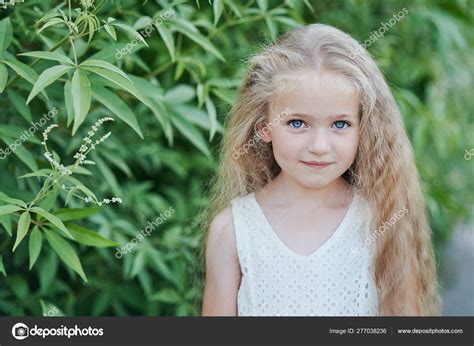 Close Up Portrait Of Beautiful Little Girl With Blonde Long Hair And