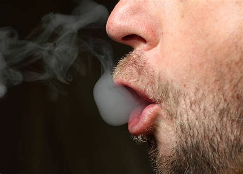 Best Lips Blowing Smoke Stock Photos Pictures And Royalty Free Images