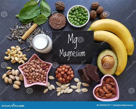 various healthy foods rich in magnesium with the symbol mg and the inscription magnesium stock