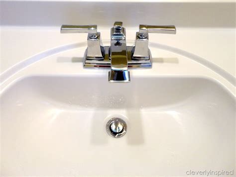 Attach the water supply lines (hot water is on the left, and cold water is in the right), and put the handles into place. Install a bathroom faucet (How to video) - Cleverly Inspired