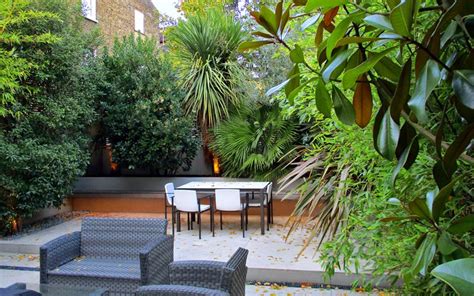 The compost in small containers will dry out quickly in the summer, so. Low maintenance garden designs London | modern gardens ...
