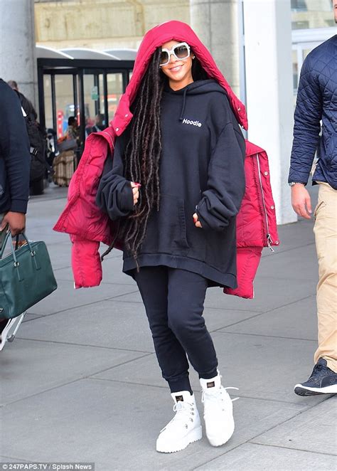 Rihanna Shows Off Dreadlocks After Flying Back To New York From Paris Fashion Week Daily Mail