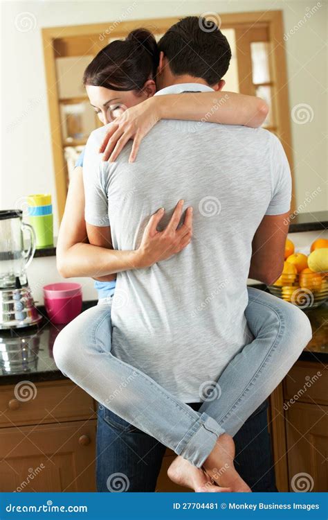 Romantic Couple Hugging In Kitchen Stock Image Image Of Sitting Loving 27704481