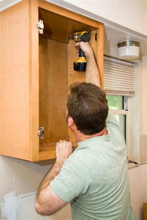 These cabinets may be less adjustable so it's important to get the unit at the exact height before drilling into the wall. How to Install Kitchen Cabinets