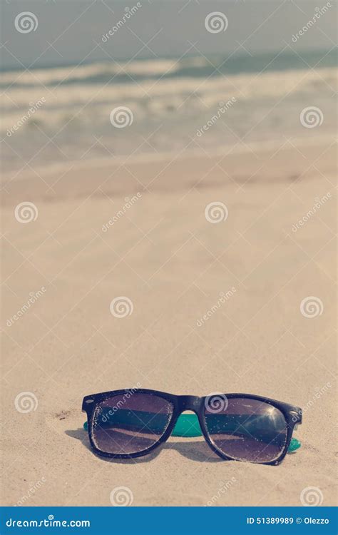 Sunglasses In The Sand On The Seashore Vacation Time Stock Image