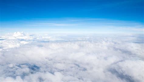 High Altitude Cloud Formations Against Blue Skies Stock Photo Image