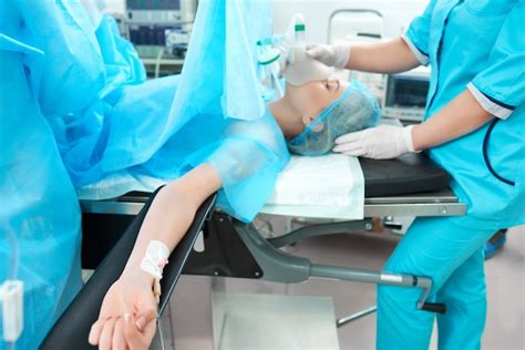 Premium Photo Horizontal Shot Of A Female Patient Lying On The Operating Table At The Surgery